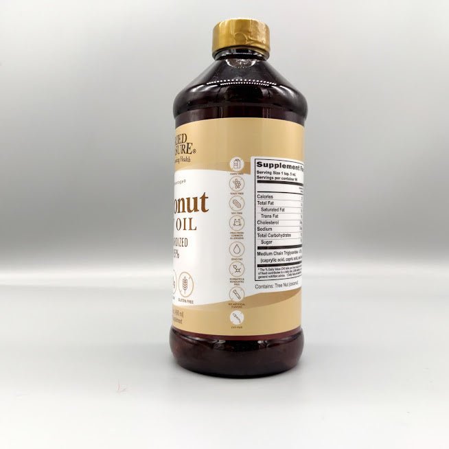 Aceite de coco Coconut Oil MCT - 16 fl oz de Buried Treasure — vista lateral del envase (foto de archivo)