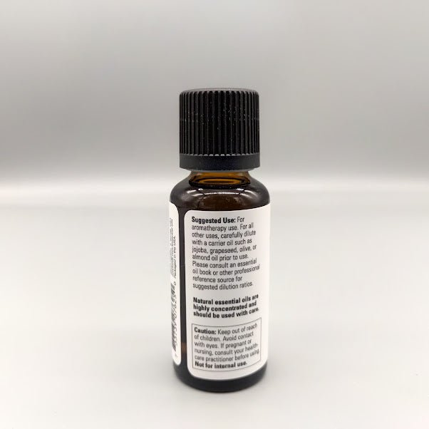 Aceite de árbol de té NOW 1 oz Melaleuca alternifolia 100% puro — vista posterior del envase