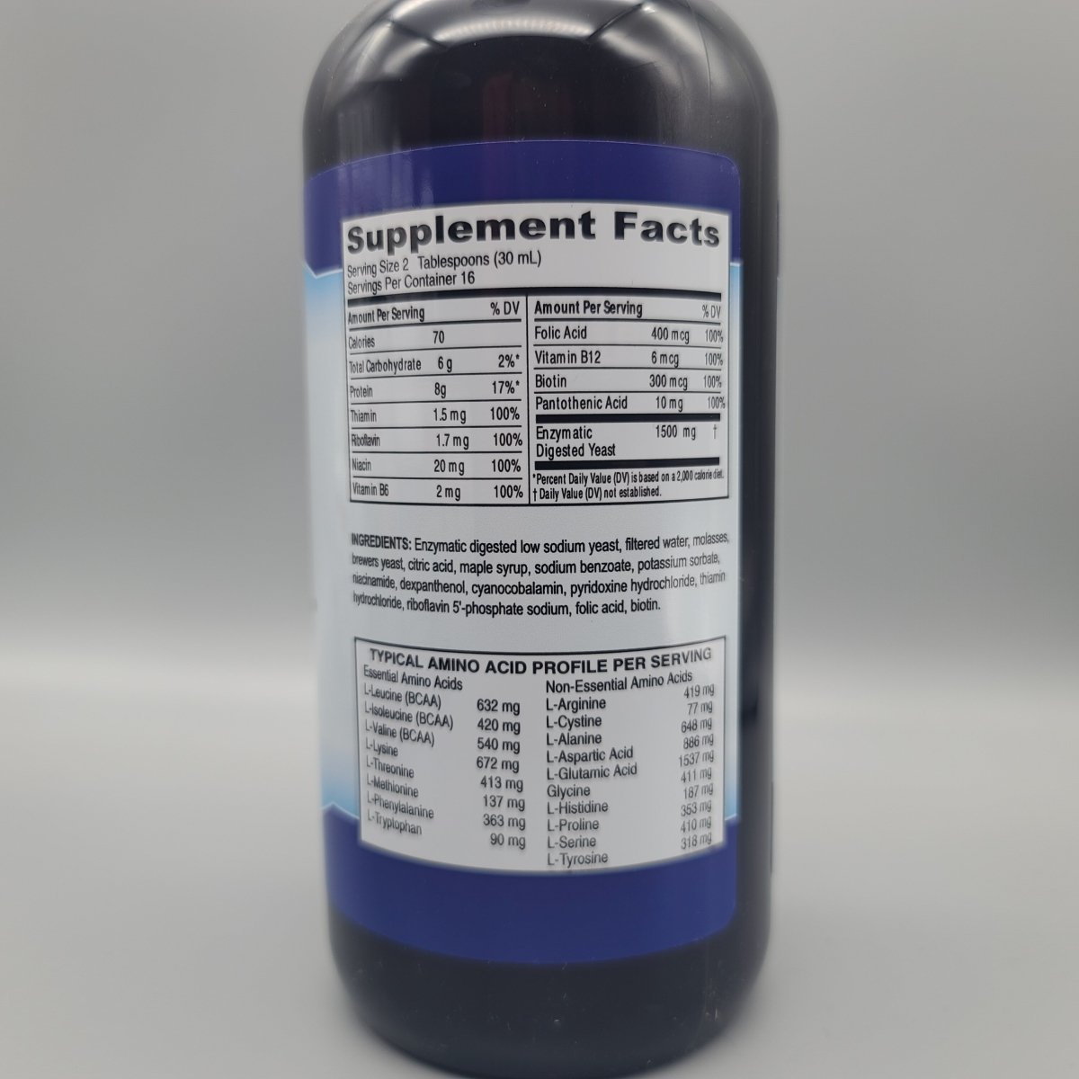 B-Complex líquido Dr. Norman 16 oz para energía y digestión — etiqueta con los ingredientes (foto de archivo)