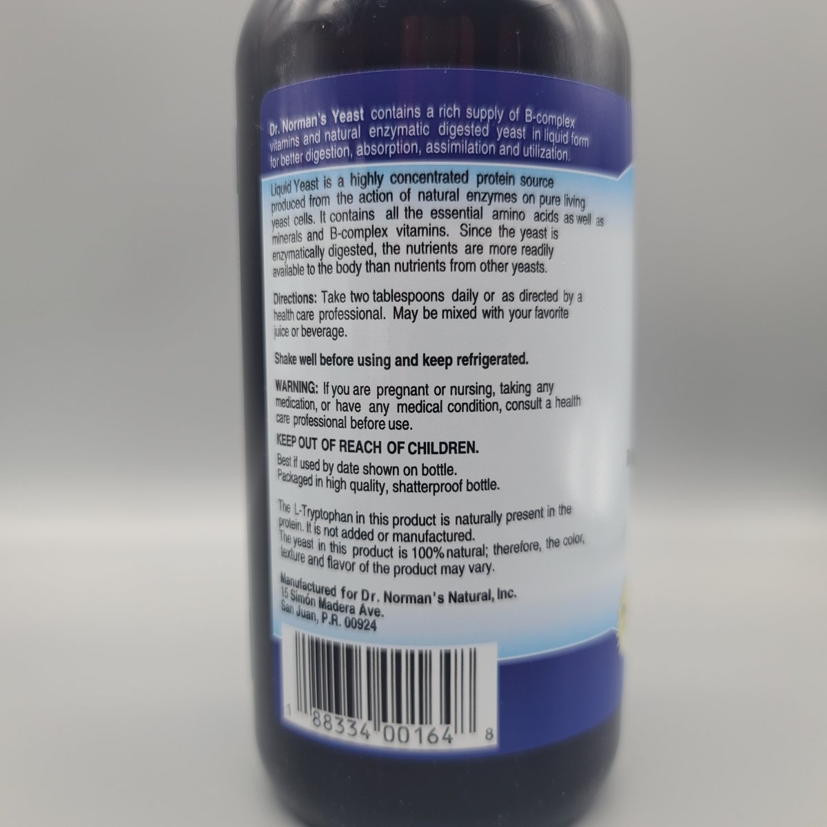 B-Complex líquido Dr. Norman 16 oz para energía y digestión — vista posterior del envase (foto de archivo)